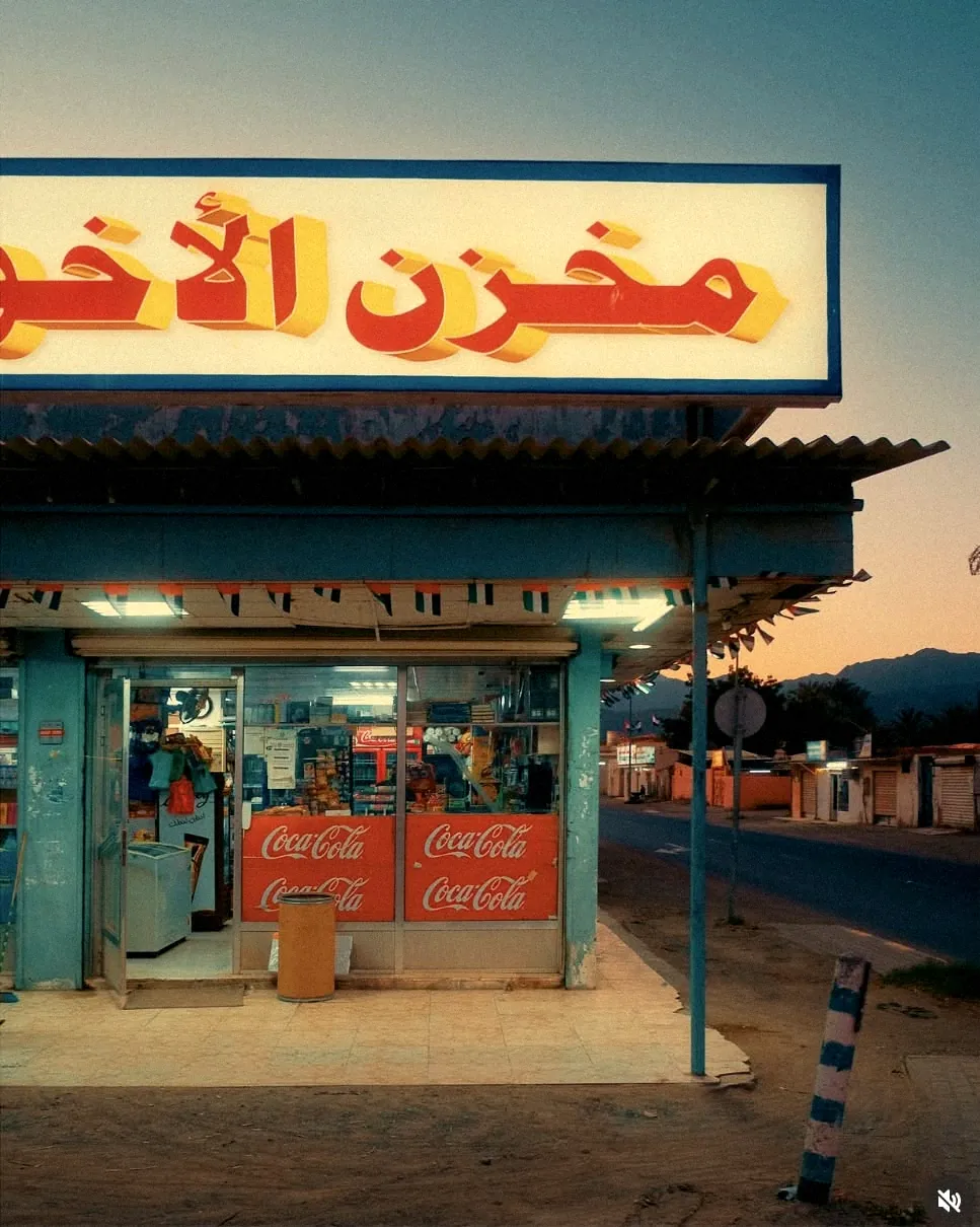 A Cairo kiosk at dusk under a hand-lettered sign